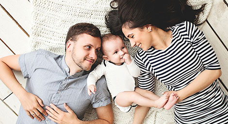 A mother and father with their baby